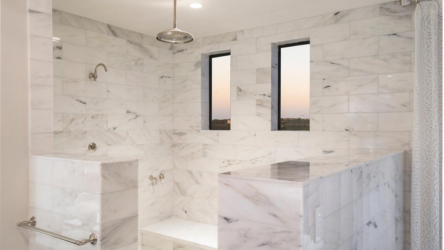 bright white shower in a bathroom with two windows