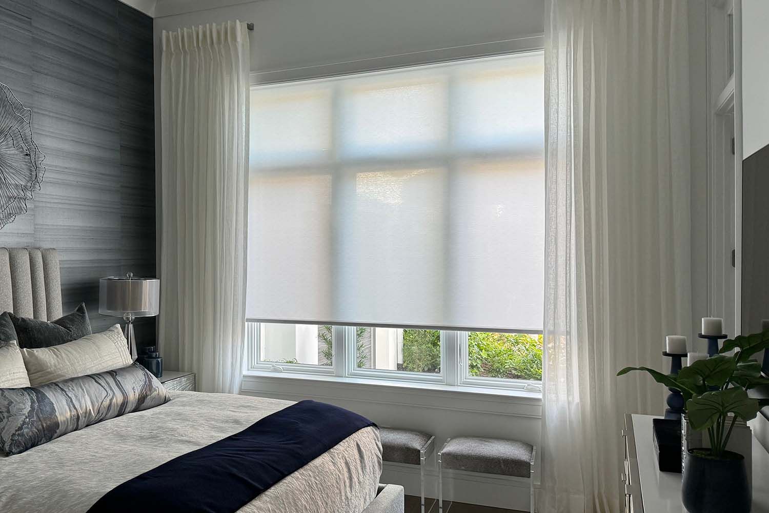 drapes and motorized shades in an inviting bedroom